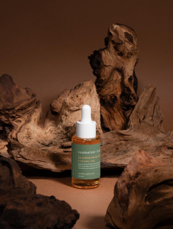 GlowRenew Botanical Facial Oil on rustic wood background – organic oil for dry and mature skin