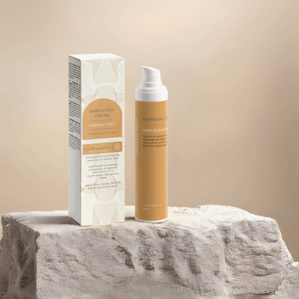 Open Shield Natural Day Cream bottle on light stone platform - Roots Guard