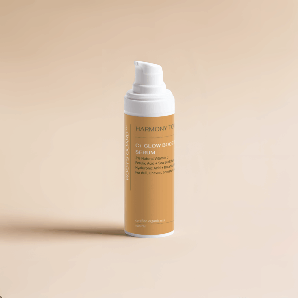 C+ Glow Booster Serum is Vitamin C Face Serum and is standing upright on beige background with clean lighting