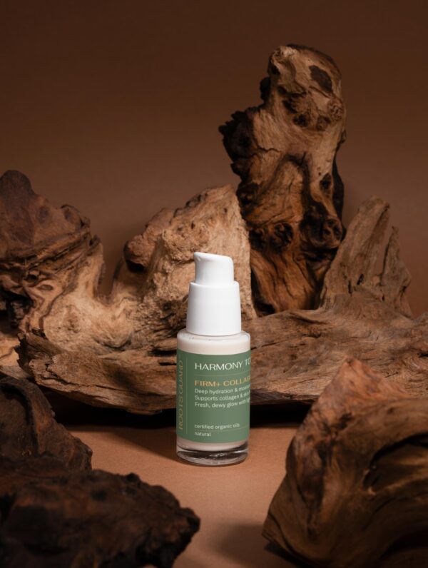 Firm+ Collagen Serum product photo with wooden background – luxury natural skincare serum